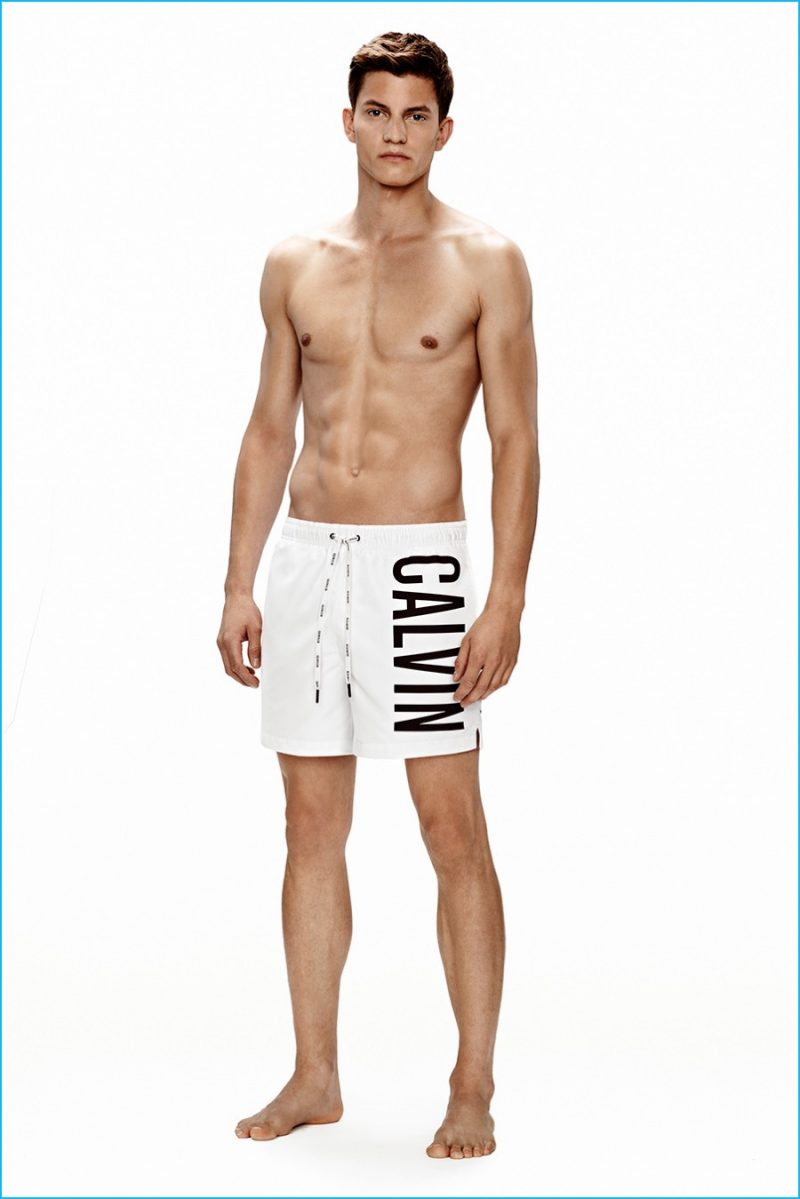 Benjamin Benedek models white Calvin Klein logo swim trunks. » Calvin Klein Puts Its Stamp on Swim Season Benjamin Benedek models white Calvin Klein logo swim trunks.