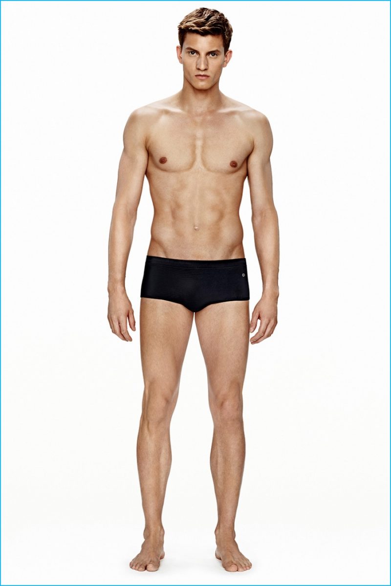 Benjamin Benedek models black Calvin Klein swimsuit.