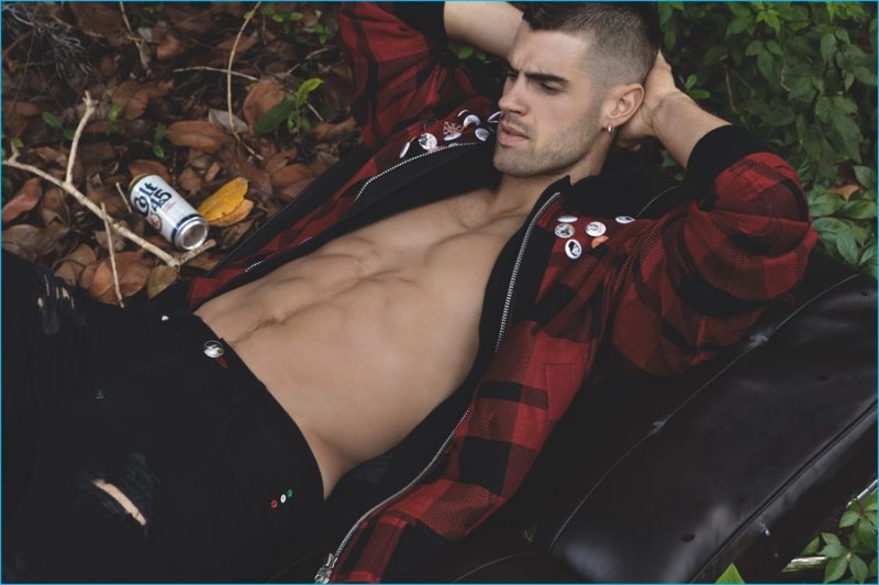 Chad White is pictured outdoors in a buffalo check red and black jacket.