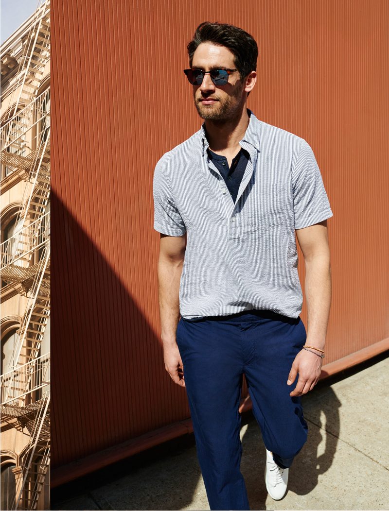 Club Monaco henley shirt, striped popover shirt, Rip-Stop joggers and Wings + Horns low-top sneakers.