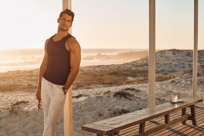 David Gandy sports a tank and beach joggers from his Autograph Beachwear collection.