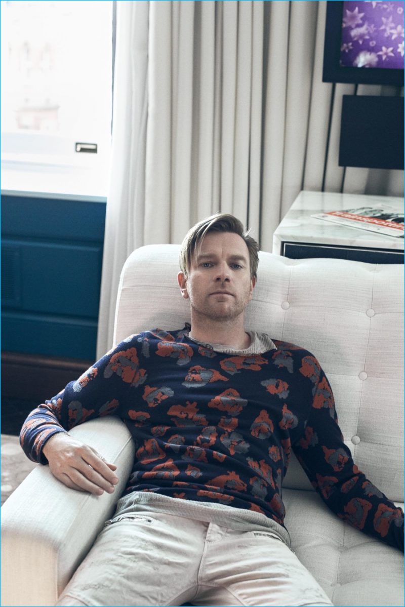Ewan McGregor dons a tee and patterned pullover from Lanvin with Just Cavalli jeans.