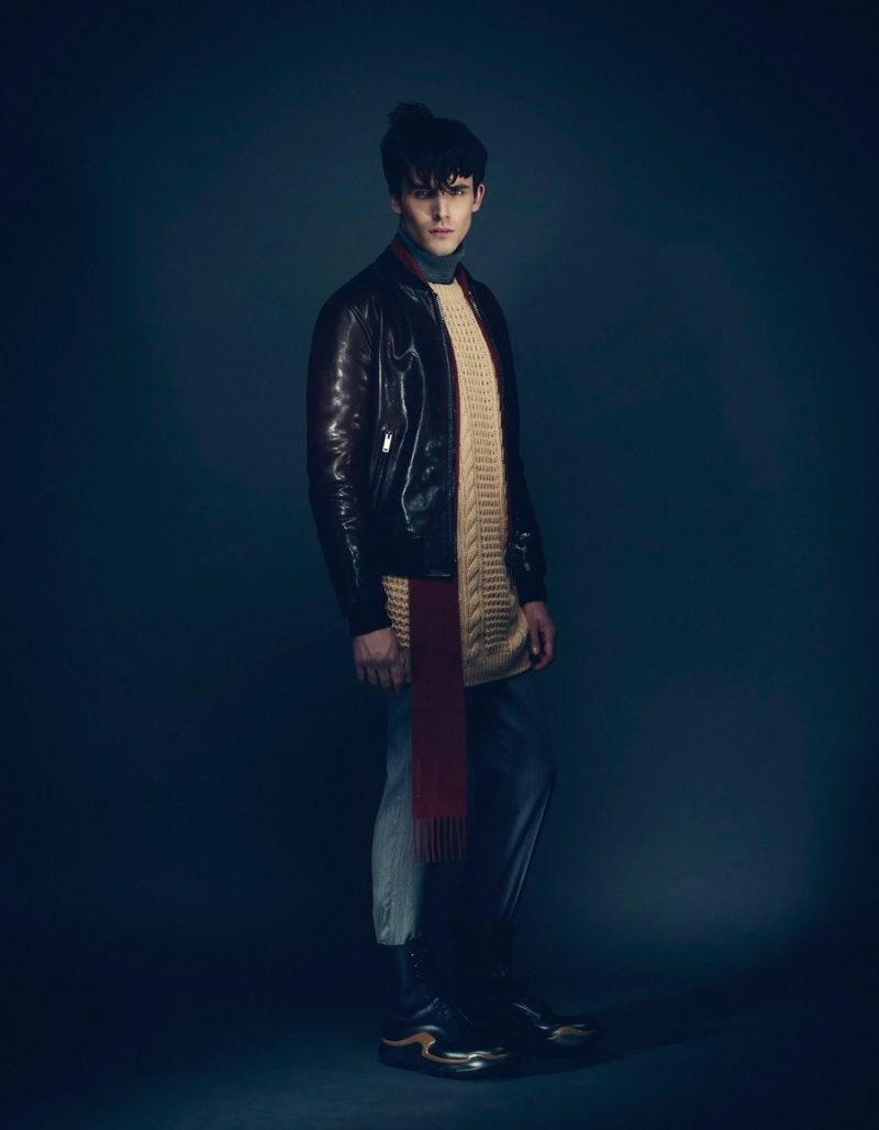 Julian wears jacket Valentino, sweater Versace, turtleneck Michael Kors, trousers Calvin Klein Collection, scarf Bottega Veneta and boots Prada.