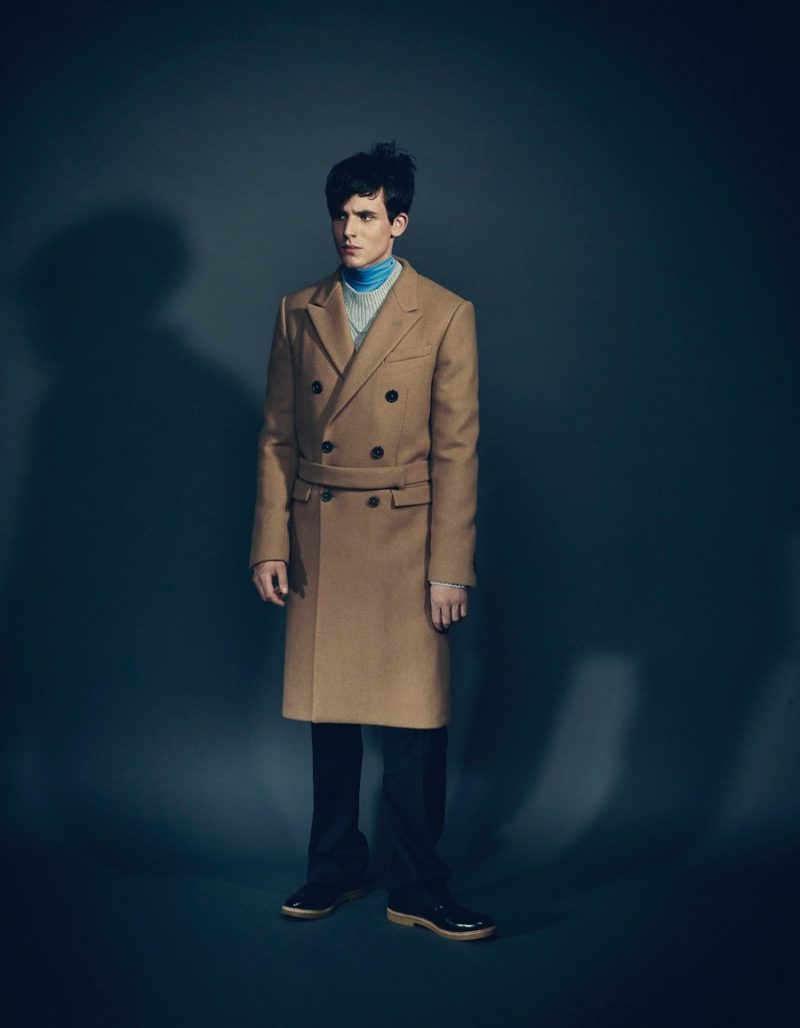 Julian wears coat Jil Sander, sweater Canali, turtleneck Raf Simons, trousers Valentino and shoes Dries Van Noten.