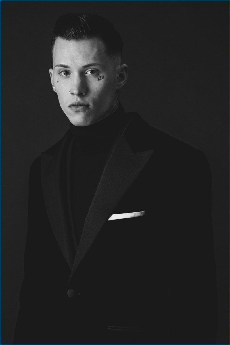 Ryan wears turtleneck sweater Hardy Amies, pocket square Jaeger, waistcoat and tuxedo jacket Stephen Williams.