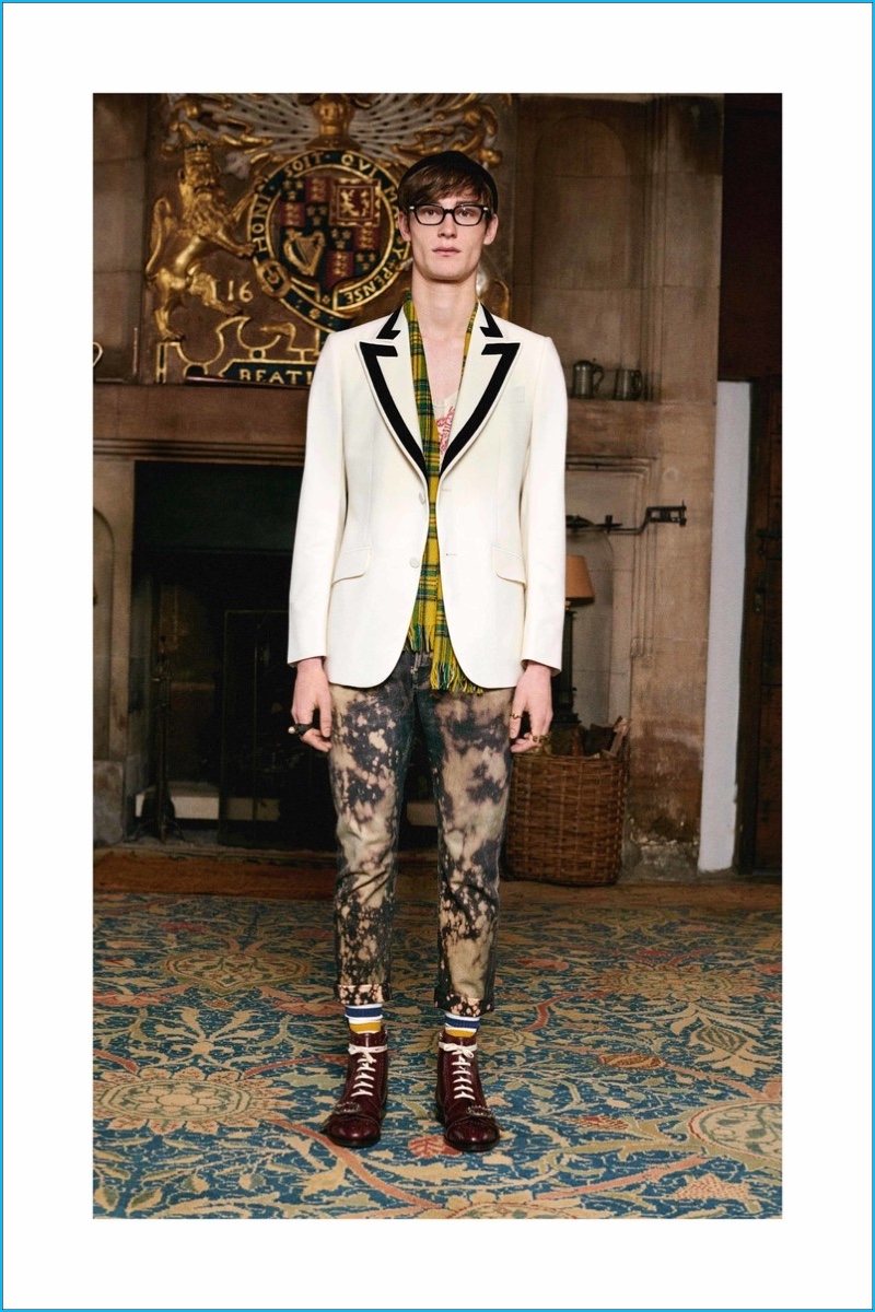 Gucci juxtaposes its tailoring with skinhead style, embracing bleached denim and leather boots.