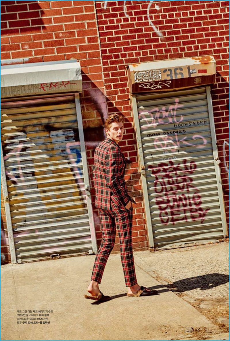 Janis Ancens ventures outdoors in a plaid suit from Gucci.