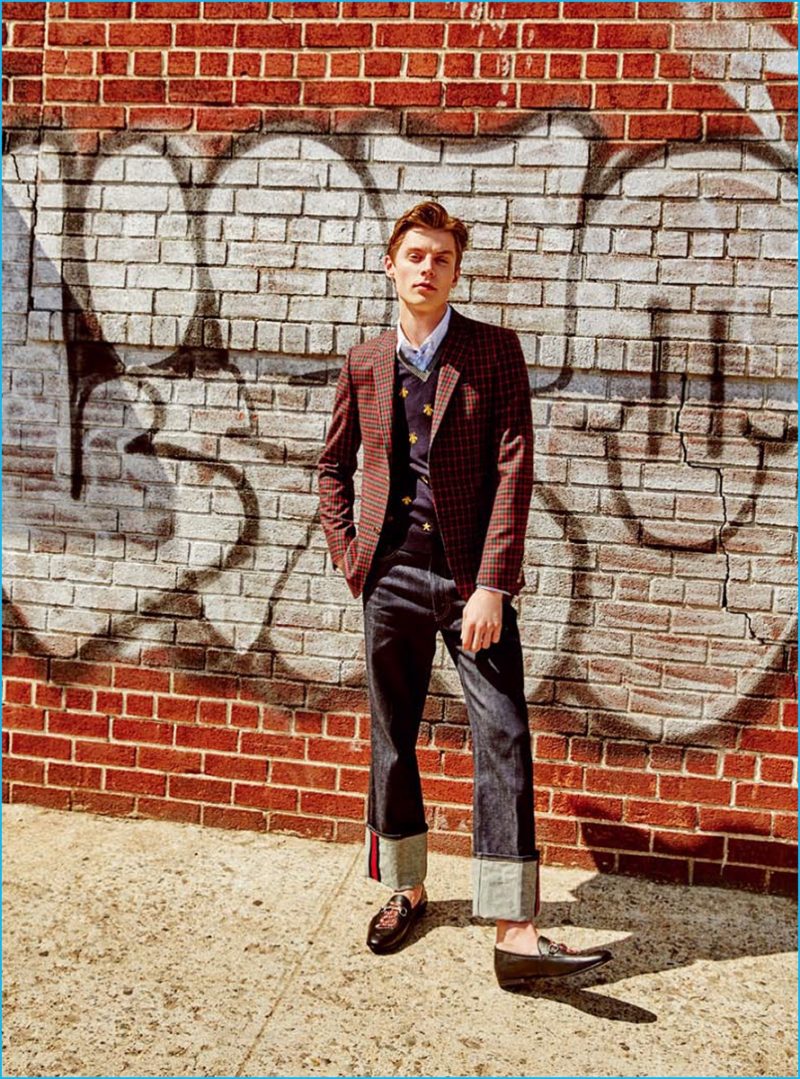 Going preppy, Janis Ancens sports wide-cut denim jeans with a plaid blazer from Gucci.