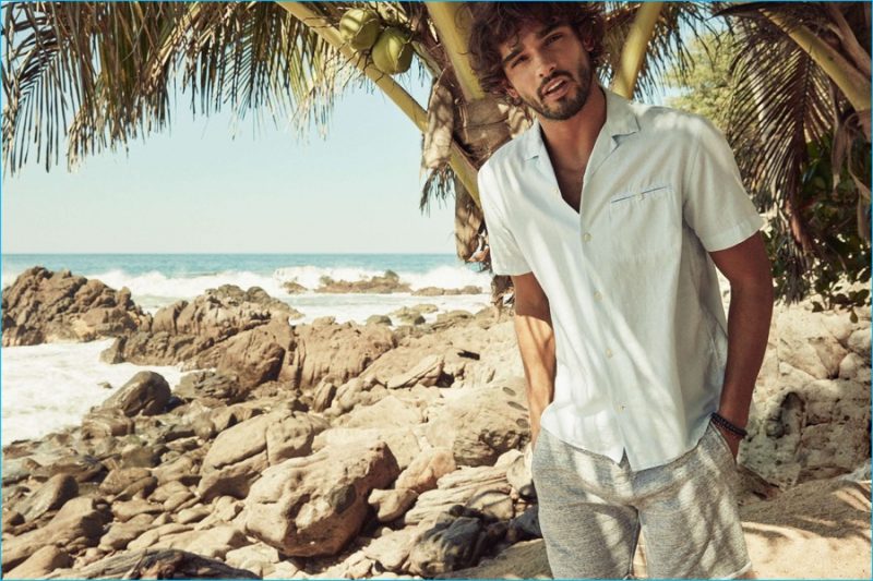 Marlon Teixeira wears sweatshorts with a Cuban collared short-sleeve shirt from H&M.