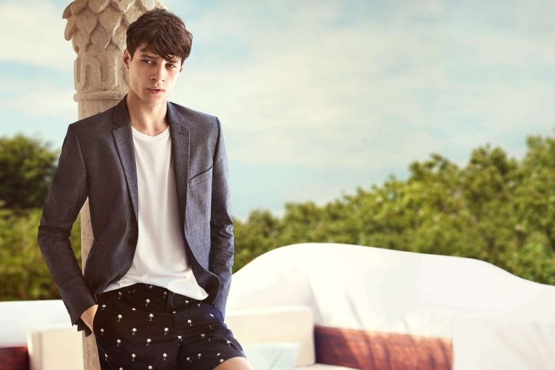 Adrien Sahores wears palm tree print cotton shorts, slim-fit blazer and pocket tee from H&M.