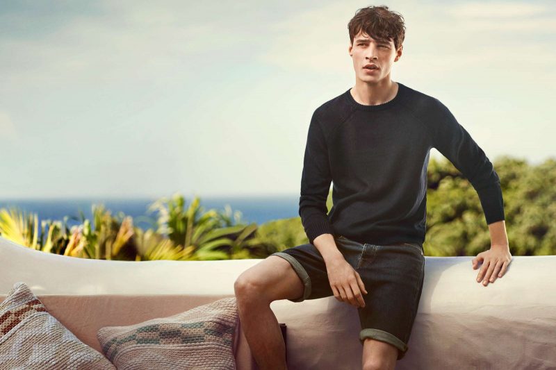 Adrien Sahores wears linen knit sweater and denim shorts from H&M.