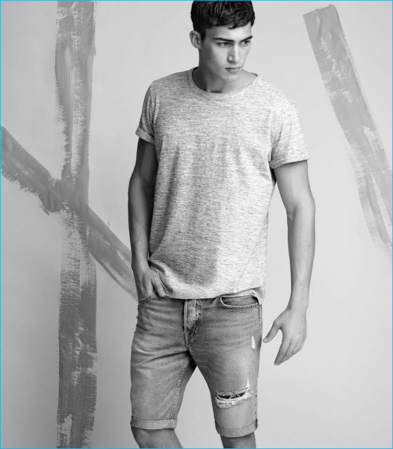 Alessio Pozzi wears denim shorts with a casual t-shirt from H&M.