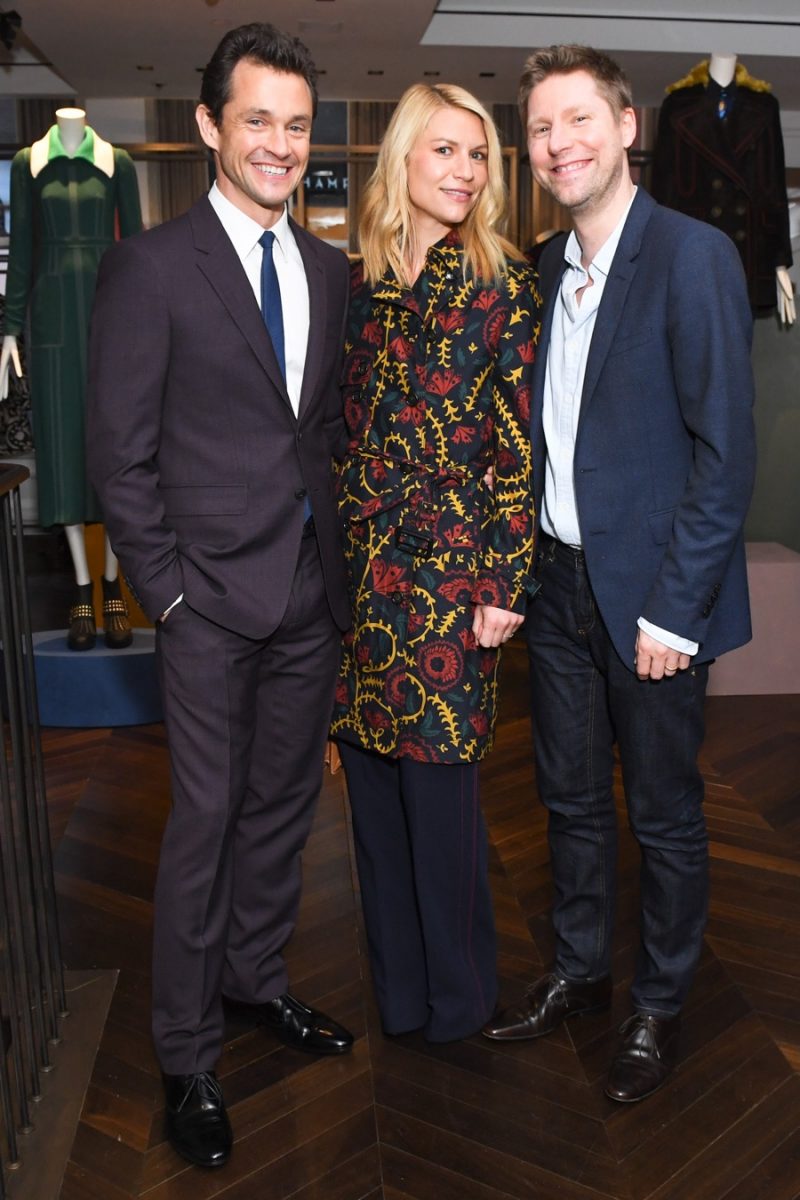 Hugh Dancy and Claire Danes pose for pictures with Burberry Chief Creative and Chief Executive Officer Christopher Bailey.