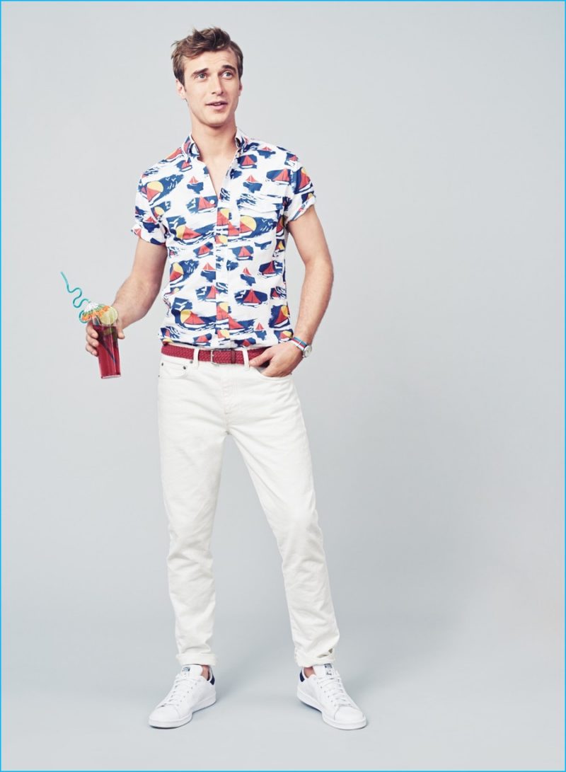 Party Statement: Clément Chabernaud wears J.Crew short-sleeve sailboat print shirt, 770 Jeans in rinsed white, red braided cotton belt, Adidas Stan Smith sneakers and Timex for J.Crew vintage field army watch.
