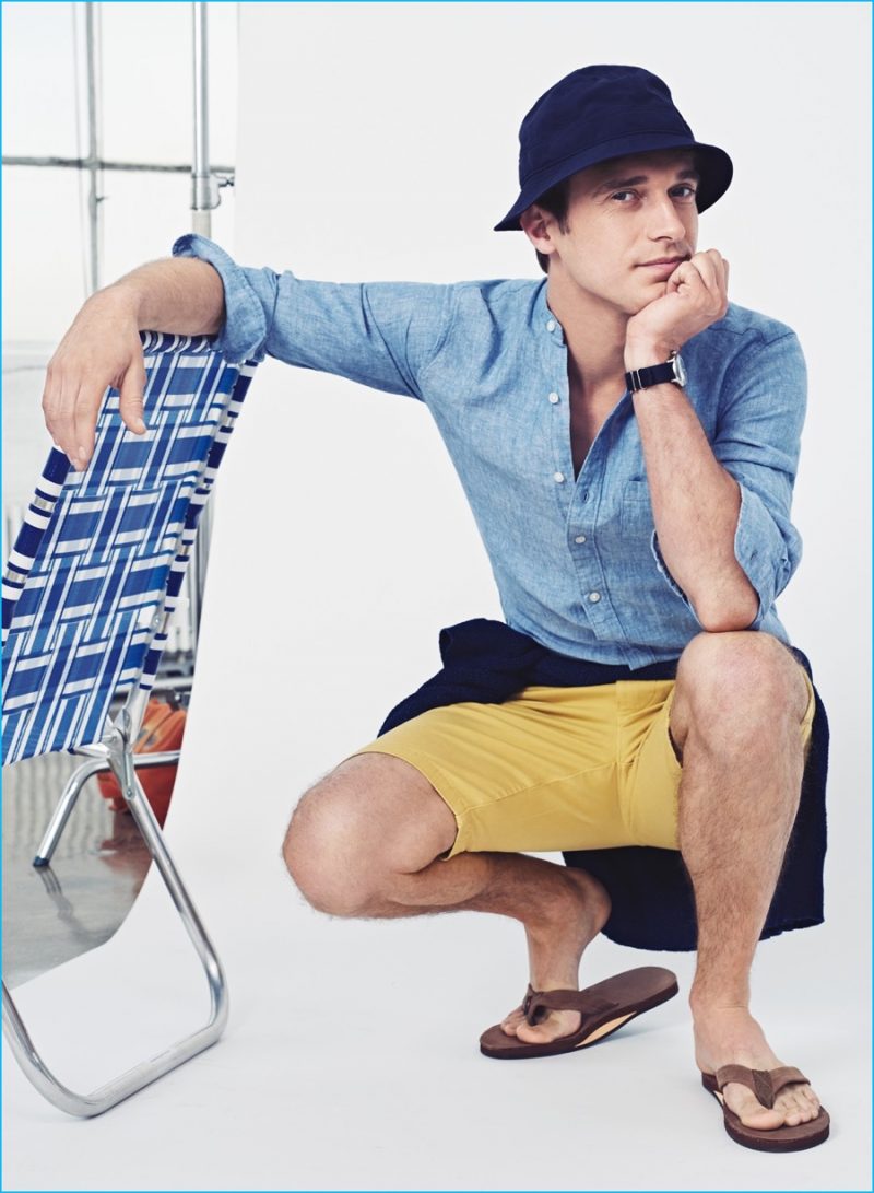 Band-Collar Champion: Clément Chabernaud wears band-collar shirt in Délavé Irish linen, 10.5" Stanton shorts, Wallace & Barnes indigo seedstitch sweater, cotton web belt, glass bead necklace, sun-safe bucket hat, Rainbow leather flip-flops and Timex for J.Crew Andros watch.