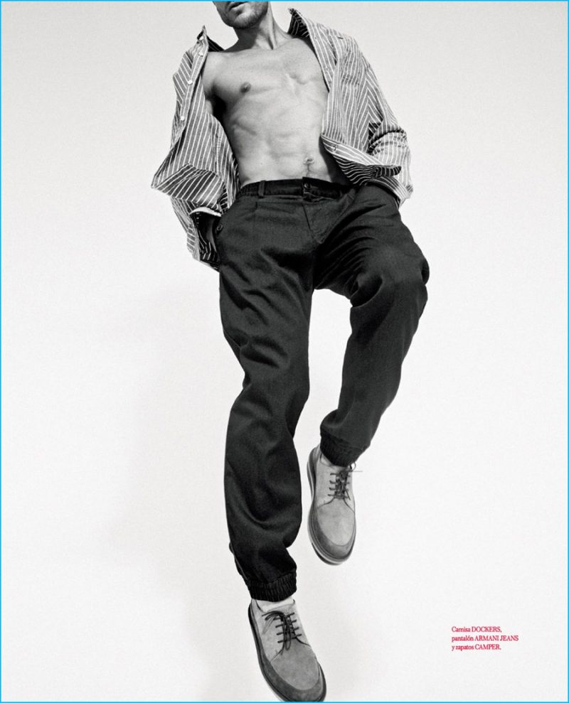 Jason Morgan goes for a leap in a striped Dockers oxford with Armani Jeans pants and Camper shoes.