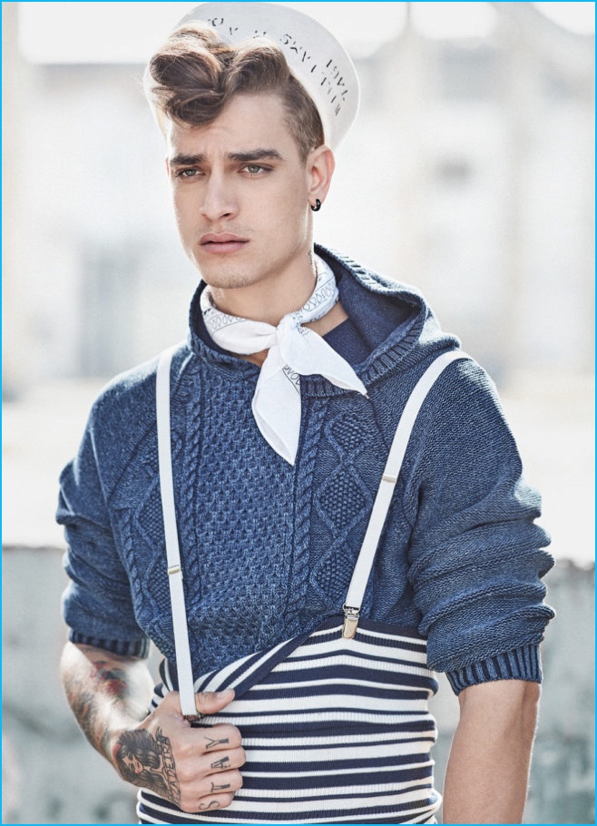 Jonathan Bellini rocks a pompadour while wearing an Ellus cableknit pullover with B.Luxo accessories and Minha Vo Tinha suspenders.