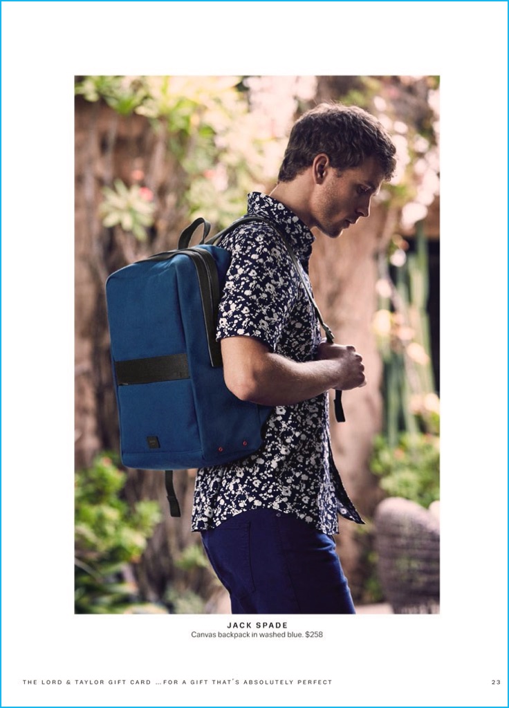 Benjamin Eidem showcases a blue backpack from Jack Spade.