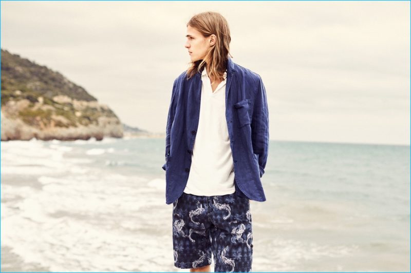 Malcolm Lindberg sports an unlined blazer with a polo shirt and patterned Bermuda shorts from Mango.