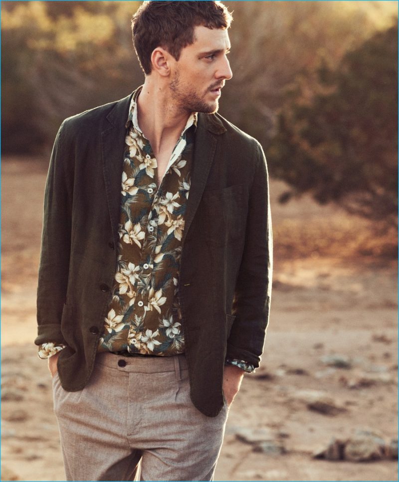 George Barnett embraces a pop of personality with Mango Man's Hawaiian shirt, paired with an unlined blazer and trousers.