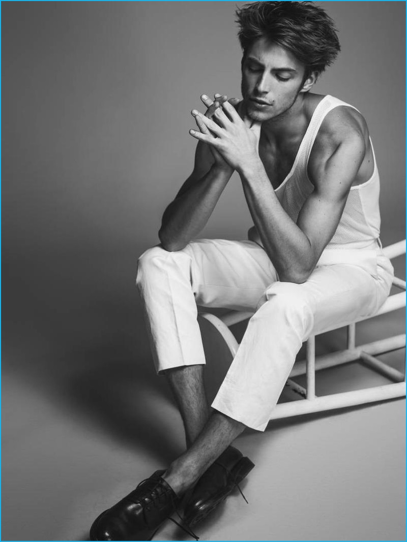 Timothée Bertoni steals a reflective moment in a Public School tank, paired with Todd Snyder trousers and Alden shoes.