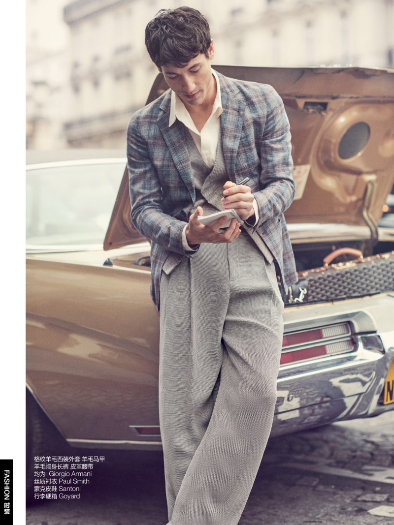 Nicolas Ripoll goes retro in relaxed grey tailoring from Giorgio Armani.