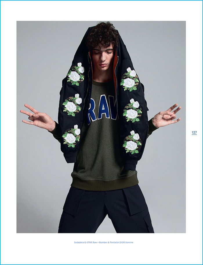 Piero Mendez models a bomber jacket and trousers from Dior Homme with a G-Star Raw pullover.