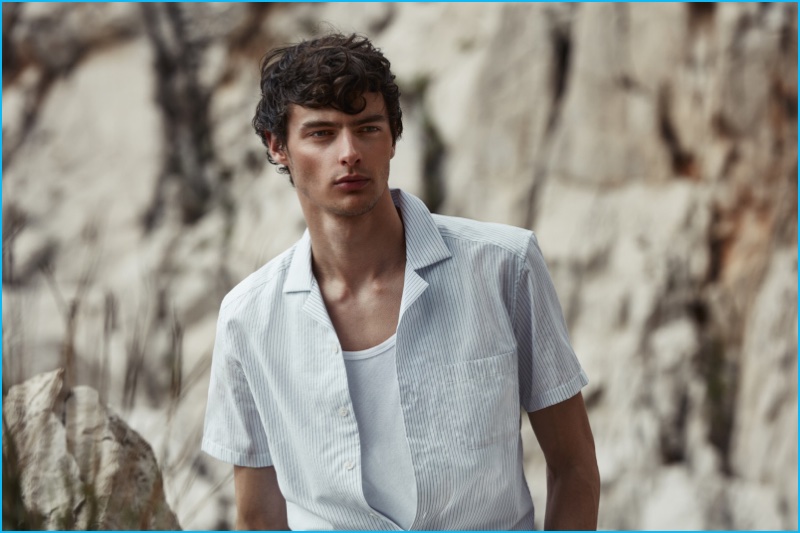 Hannes Gobeyn is a trendy vision in a Cuban collar short-sleeve shirt and casual t-shirt from Reiss. 