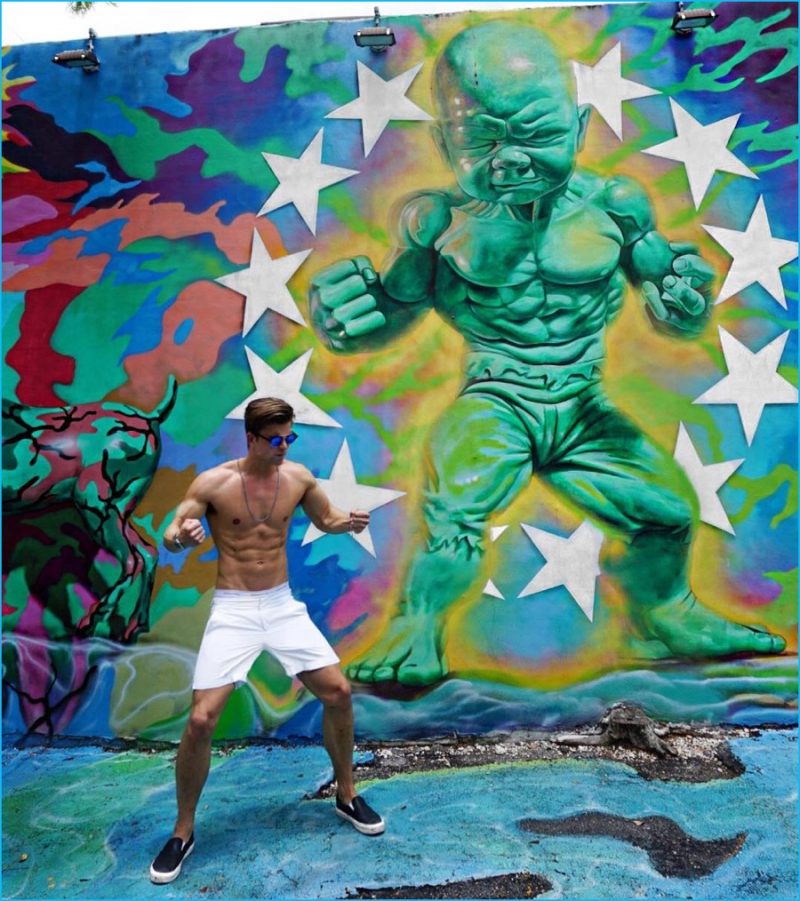 River Viiperi is Miami bound, posing against the Wynwood Walls.