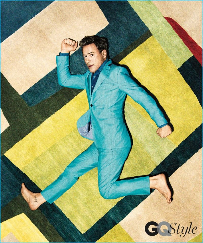 Robert Downey Jr. poses in a colorful BOSS Hugo Boss suit.