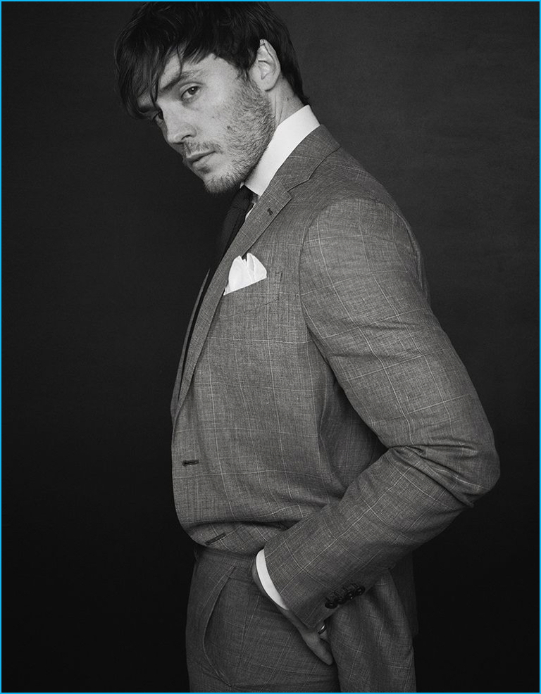 Sam Claflin dons a sharp tailored suit from Ermenegildo Zegna Made to Measure.