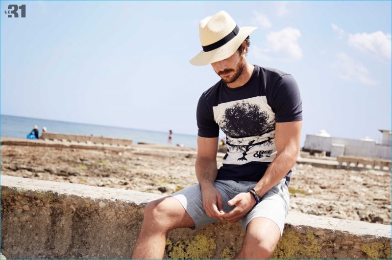 Justice Joslin heads to the beach, sporting a Panama hat.