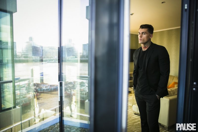 Stephen James wears black on black in a Lanvin suit with a Tiger of Sweden tee.