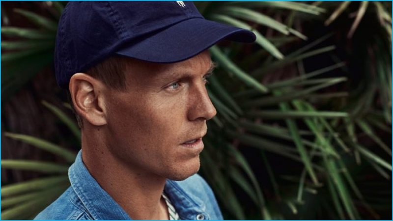 Tomas Berdych wears western denim shirt Chimala, striped linen t-shirt Gucci and baseball cap Polo Ralph Lauren.