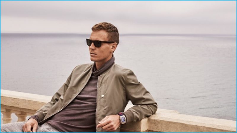 Tomas Berdych wears bomber jacket Brunello Cucinelli, rollneck sweater Paul Smith, sweatpants J.Crew and sunglasses Acne Studios.