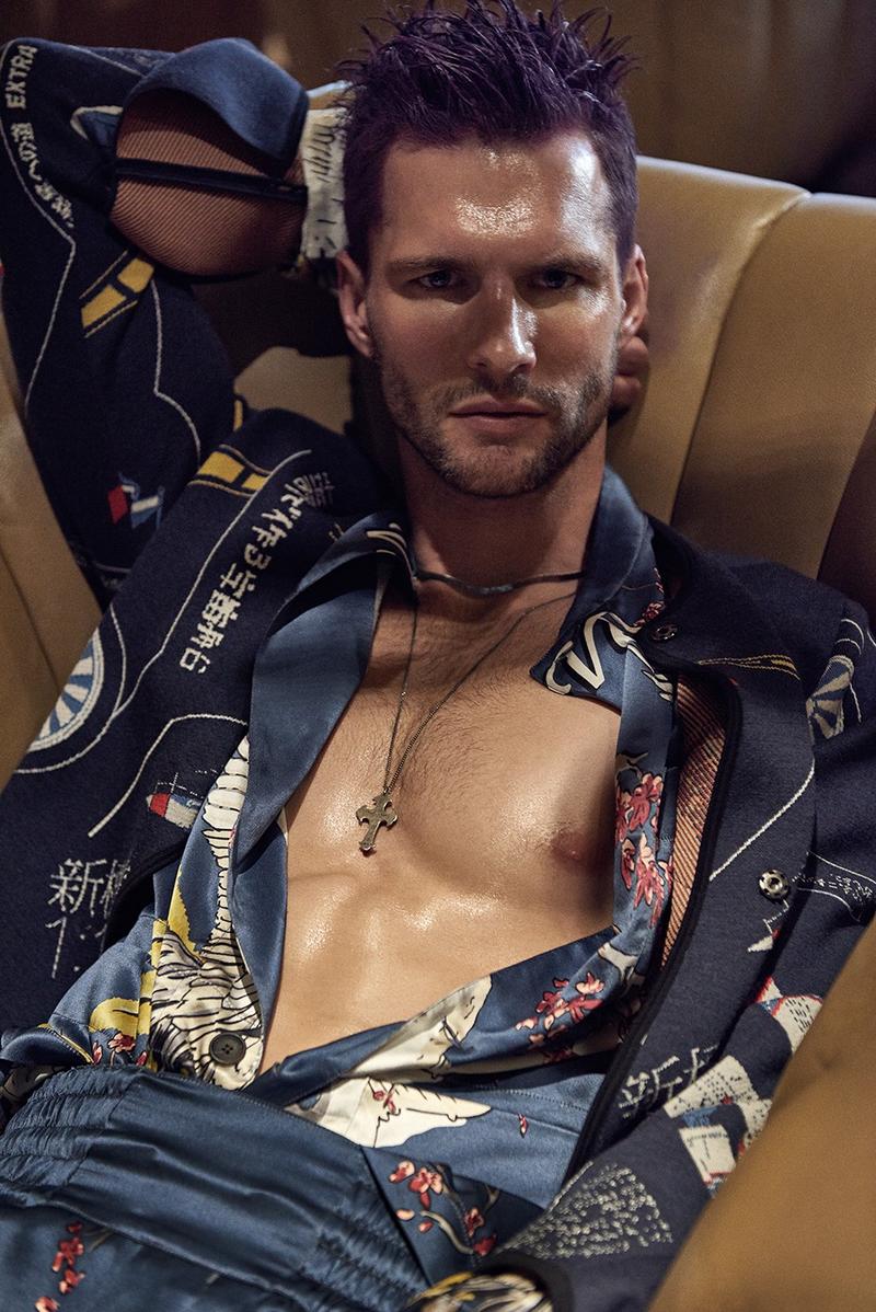 Tomas Skoloudik dons a silk patterned look from Louis Vuitton, complemented by a Loewe jacket.