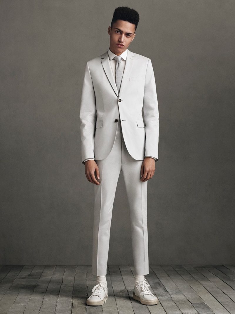 Topman embraces light neutrals with a monochromatic suit, paired with sneakers and socks.