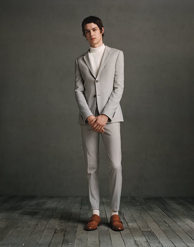 Topman mixes neutrals for a grey suit and white turtleneck look.