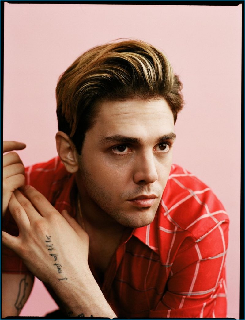 Xavier Dolan dons a red check shirt from Louis Vuitton.