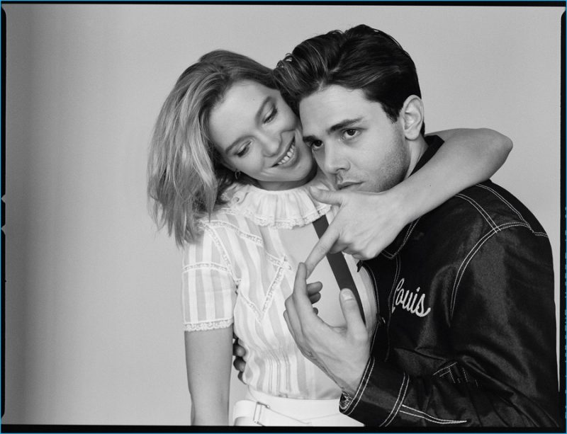 Sporting a Louis Vuitton jacket, Xavier Dolan is photographed embracing Léa Seydoux.