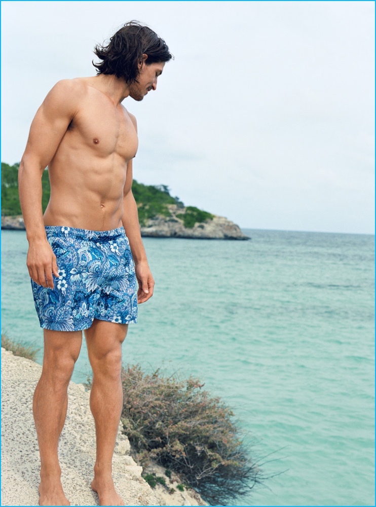 Jarrod Scott sports printed swim shorts from Zara.