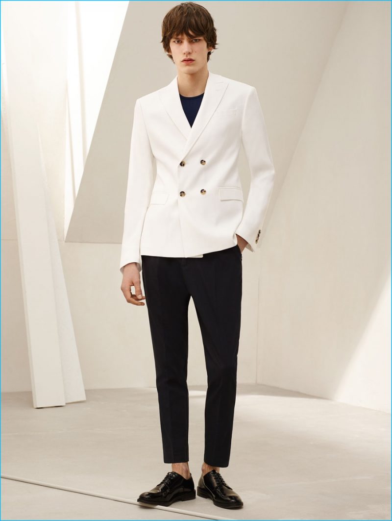 Elias de Poot models a white double-breasted blazer, sweater, cropped trousers and antik leather bluchers from Zara Man.