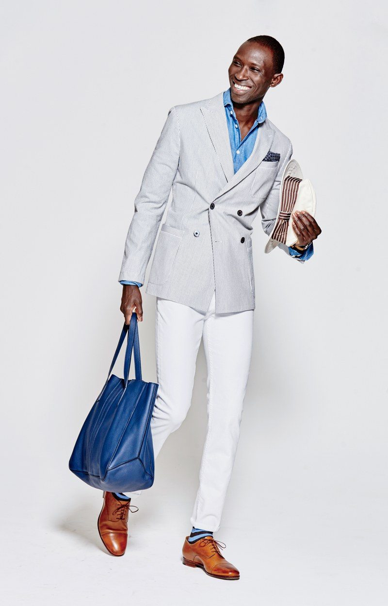 Armando Cabral is all smiles as he hits the photo studio in a double-breasted sport jacket from Banana Republic. The dapper look is completed with Levi's white jeans and shoes from his own line.