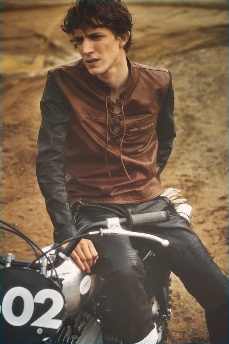 Xavier Buestel is front and center in moto leather pants and a leather lace-up top from Belstaff's spring-summer 2017 collection.