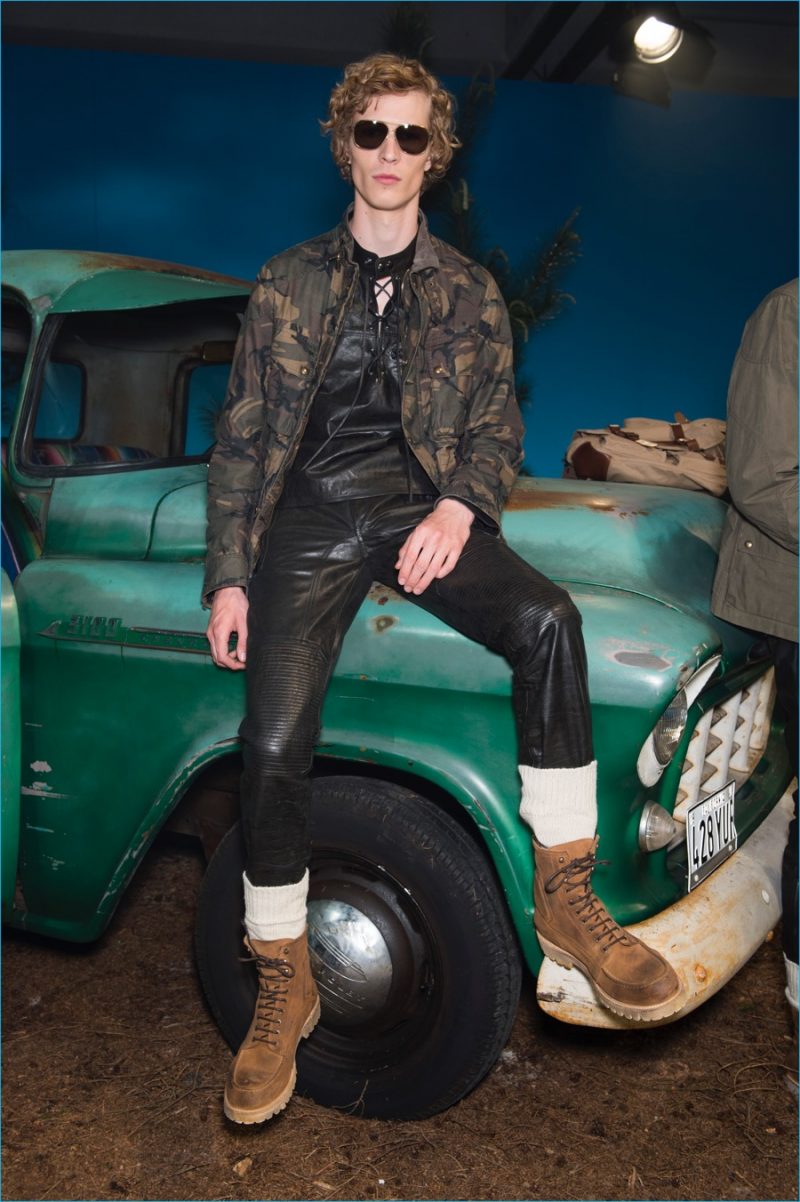 Sven de Vries is front and center in a camouflage jacket with leather moto pants from Belstaff's spring-summer 2017 collection.