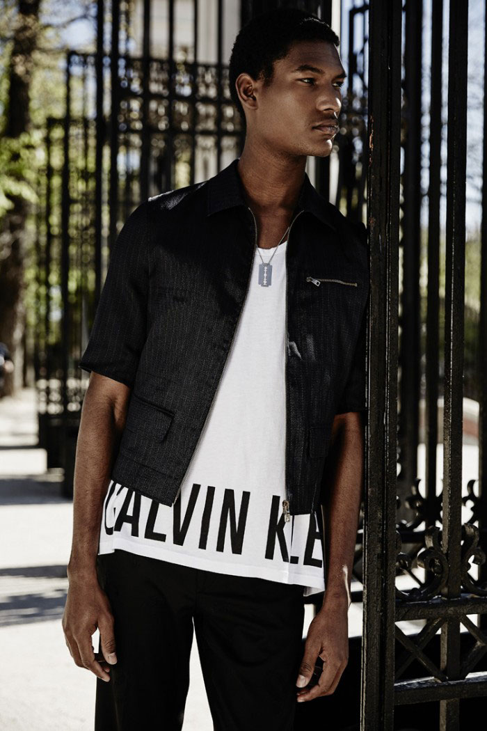 Brad Allen sports a casual look centered around one of Calvin Klein's popular logo tee.
