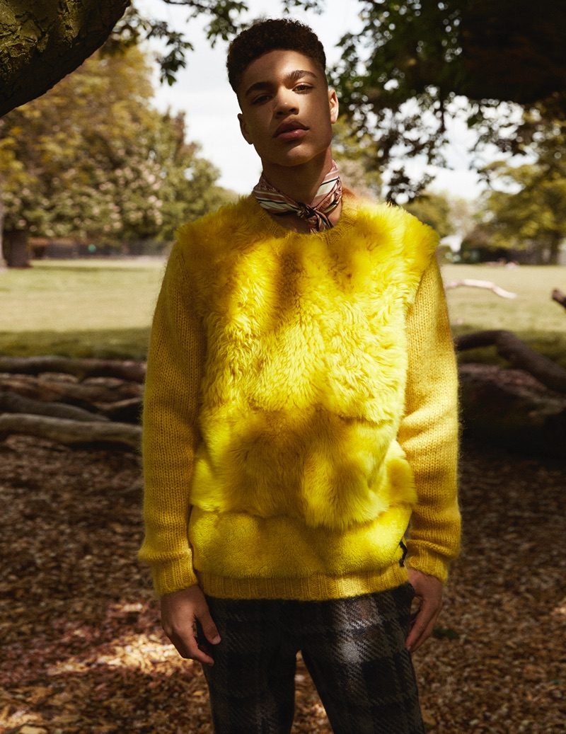 Brian Whittaker dons a yellow statement sweater from Fendi's fall-winter 2016 collection.