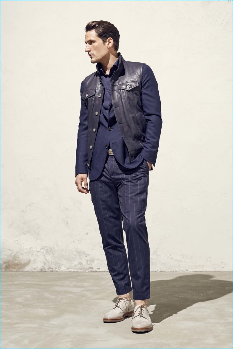 Brunello Cucinelli champions separates dressing, pairing pinstripe trousers with a leather vest.