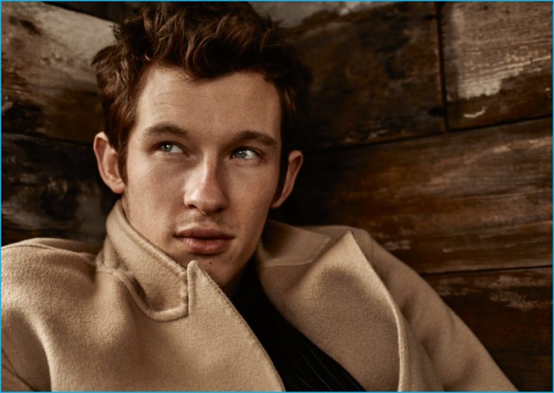 Callum Turner pictured in a Burberry camel coat.