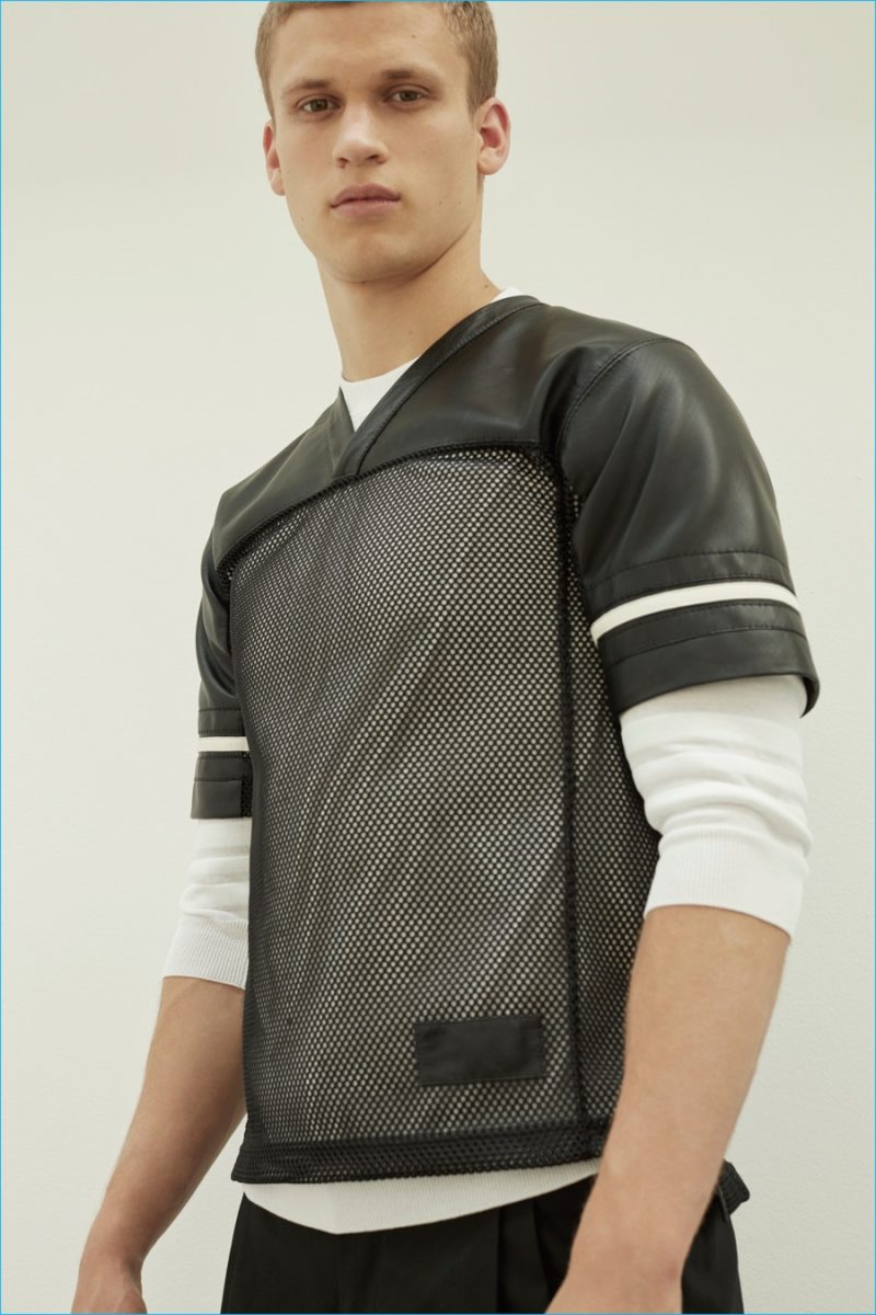 Calvin Klein Collection has a football style moment with a leather and mesh jersey inspired top for spring-summer 2017.